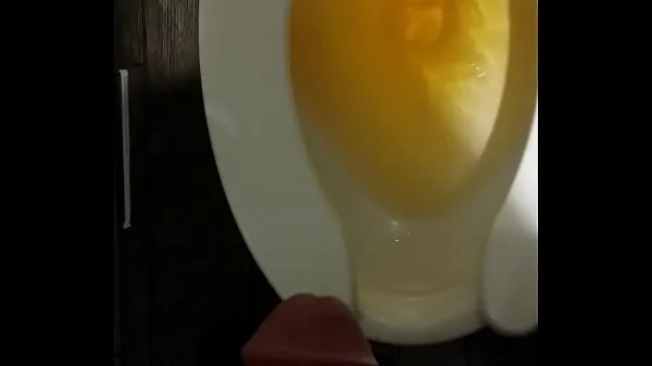 Show Another long yellow piss in a public toilet energy Clips